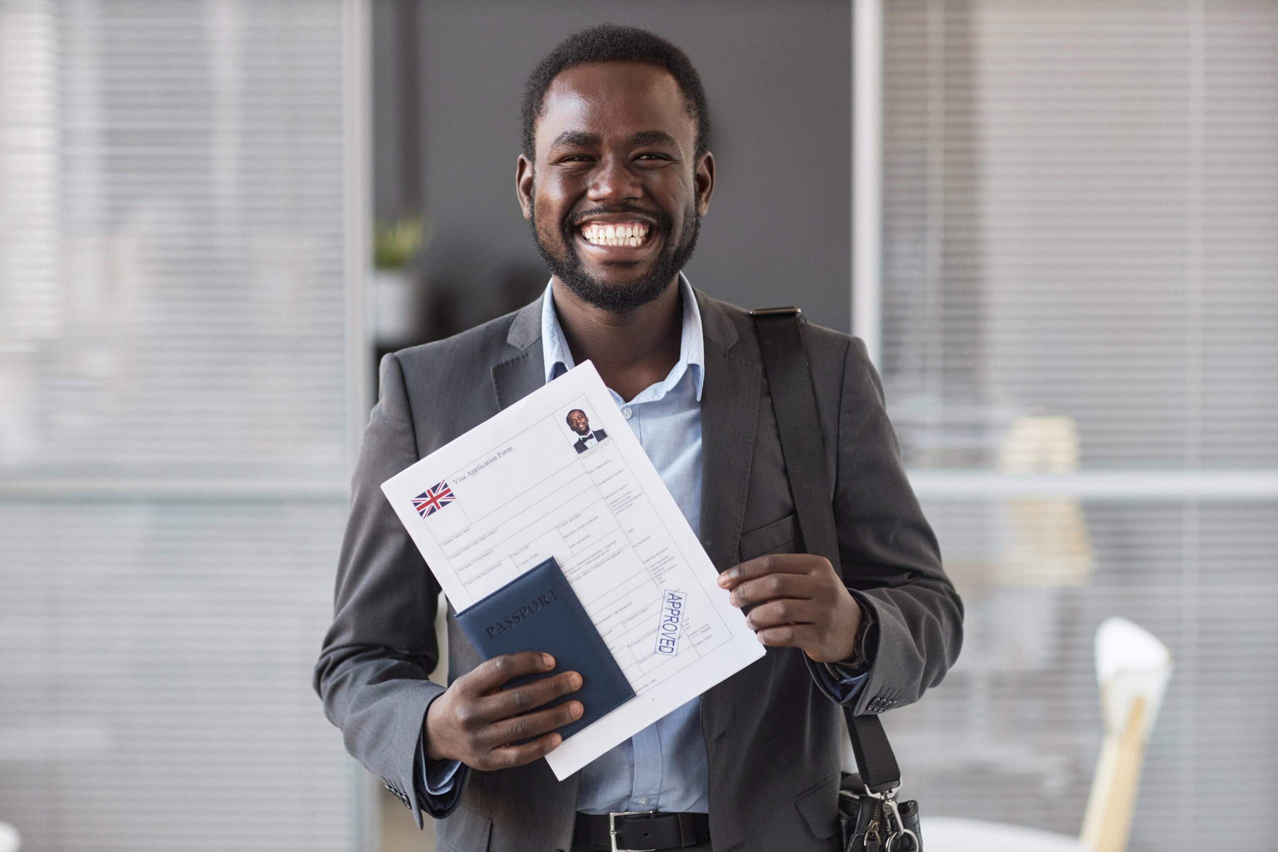 Young cheerful African American male applicant in formalwear